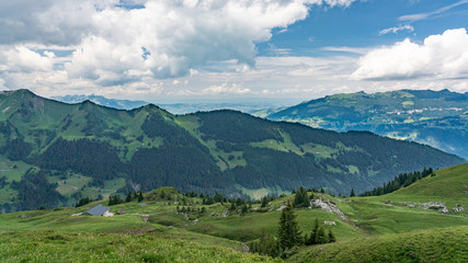 Fototapeta na wymiar Switzerland, Panoramic view on green Alps near Schynige Platte, Saxeten valley