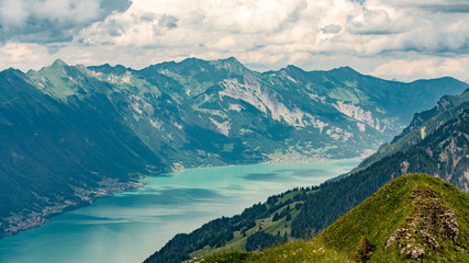 Naklejka na ściany i meble Switzerland, Panoramic view on green Alps and lake Brienzersee from Saxeten valley