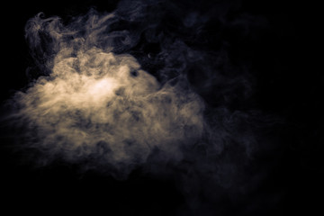 Jet of smoke on black background. Selective focus. Toned