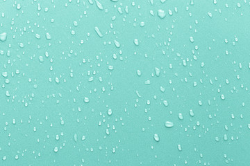 Drops of water on a color background.