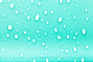 Drops of water on a color background. Blue. Toned