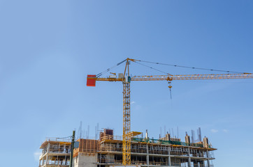 Building under construction. The site with crane.