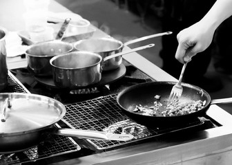 Chef cooking in a kitchen, chef at work, Black & White.