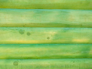 Bright green colored wooden background made of natural wood planks making a wall or other wooden surface in green color
