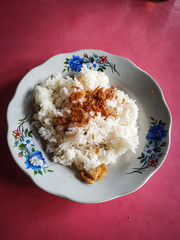 White rice isolated on pink background