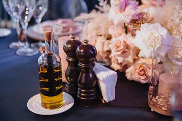 Festive table setting with a bouquet of flowers and candles.