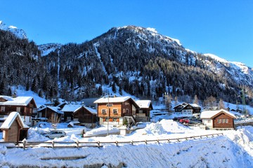 SNOW COVERED HOUSES AND BUILDINGS AGAINST SKY - obrazy, fototapety, plakaty