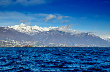 Alpine Lake Maggiore with Brissago Islands and Snow-capped Mountain in Ticino, Switzerland.