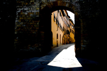 Old Street to a Village Colle Val’Elsa with Sunlight in Tuscany, Italy.