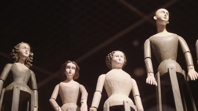 Vintage Venetian dolls in a showcase. Handmade puppets during a free exhibitio. 4k	