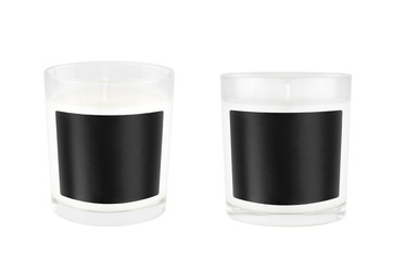 Two white candles in transparent glass with black blank label on isolated, mock up for branding identity, advertising, presentation, design packing.