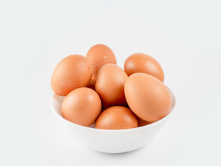 Put eggs in one bowl on white background