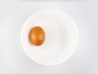 Put eggs in one bowl on white background