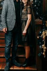 Fototapeta na wymiar Couple Standing next to Stairs