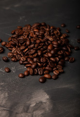 Composition with a coffee beans on a textured plastered background with a variety of arbitrary stains