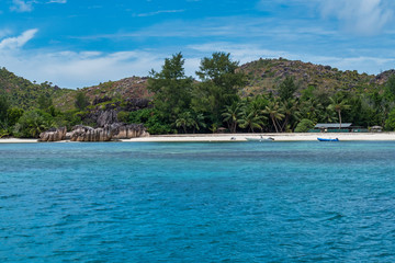 Fototapeta na wymiar The coastline white sand beach of the island of Curieuse, Seychelles