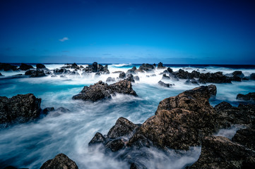 Porto Moniz - Long exposure of rocks and waves at vulcanic coast - beautiful landscape scenery of Madeira Island, Portugal