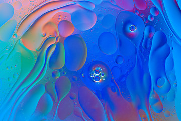 gradient blue smears and oil drops on water surface, abstract background, texture