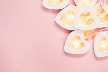 Valentine's day or wedding party decoration. Romantic pink background with heart garland. Minimal Valentine's Day Card