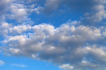 Naklejka na ściany i meble Beautiful white clouds on the natural background of the blue sky