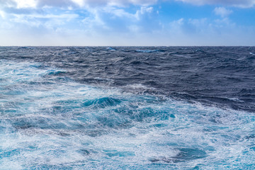Naklejka na ściany i meble Heavy waves at sea on a cruise
