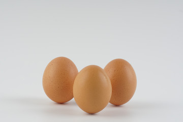 Three eggs on white background.