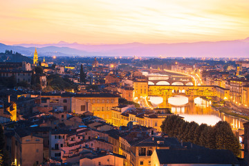 Fototapeta na wymiar Florence cityscape and Arno river bridges sunset view