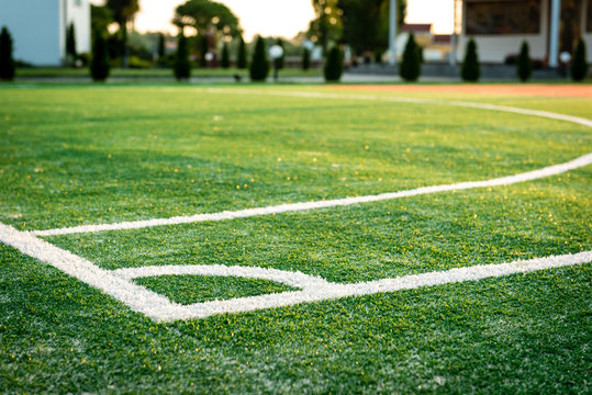 Outdoors mini football court with artificial turf.