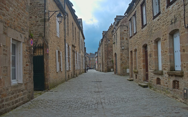 Fototapeta na wymiar Empty street with traditional stone houses at Dinan, France