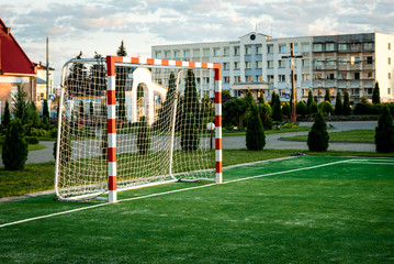 Outdoors mini football court with artificial turf.