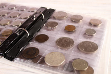 Many coins of different countries and times. Numismatics