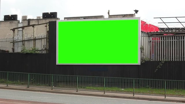 Blank Billboard for advertising. Green Screen for Chroma Key. Traffic drives past.