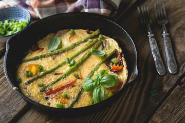 Frittata. Italian omelet with asparagus and bell pepper