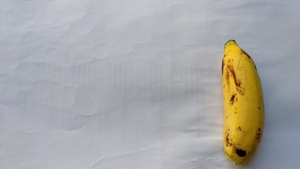 banana which is yellow and still fresh on a white background
