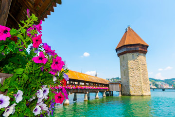 City of Lucerne with Chapel Bridge Tower in a Sunny Day in Switzerland.