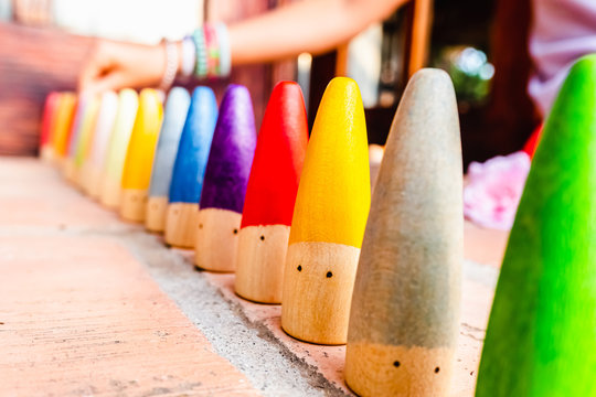 Toy set conical pieces of wood painted in colors for unstructured children's games.