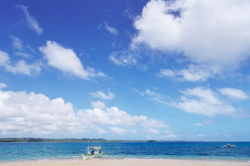 Beautiful landscape with tropical white sand beach with fishing and tourists boat. Siargao Island, Philippines.