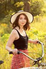 Obraz premium girl with bicycle