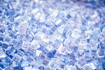 Blue and shiny ice cubes, cold background