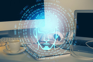 Double exposure of table with computer and brain hologram. Data innovation concept.