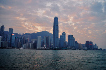 Fototapeta na wymiar Hong Kong skyline cityscape downtown skyscrapers over Victoria Harbour at sunset time. Hong Kong, China.
