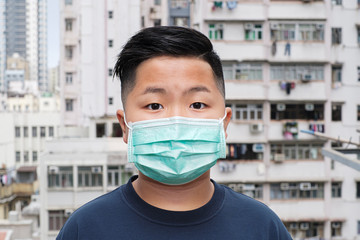 Asian young kid wearing a mask