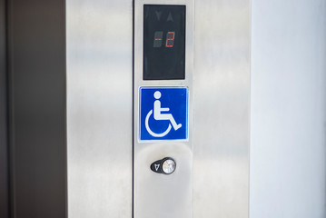 Disabled sign in the lift for disabled persons