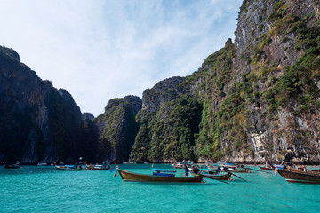 Naklejka na ściany i meble Vacation in Thailand. Phi Leh lagoon of Phi Phi Leh Island. Beautiful landscape with sea, boat and rocks.