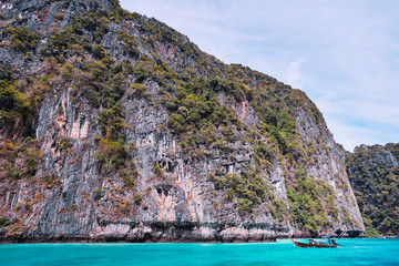 Vacation in Thailand. Phi Leh lagoon of Phi Phi Leh Island. Beautiful landscape with sea, boat and rocks.