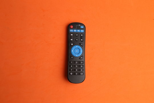 TV remote control in color background
