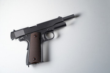 Big black gun pistol on white background.