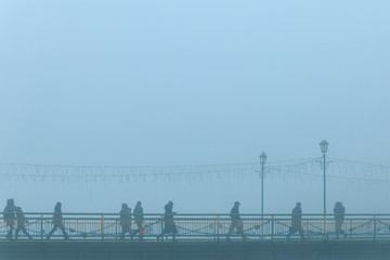 Dense fog enveloped the evening city