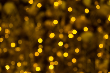 Fototapeta na wymiar Lighting bulb and decorative golden pine tree Merry Christmas and Happy New Year for abstract background texture, Selective focus