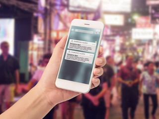 warning alert sms via smart phone for infective outbreak situation on phone screen. catastrophic situation news update system for people